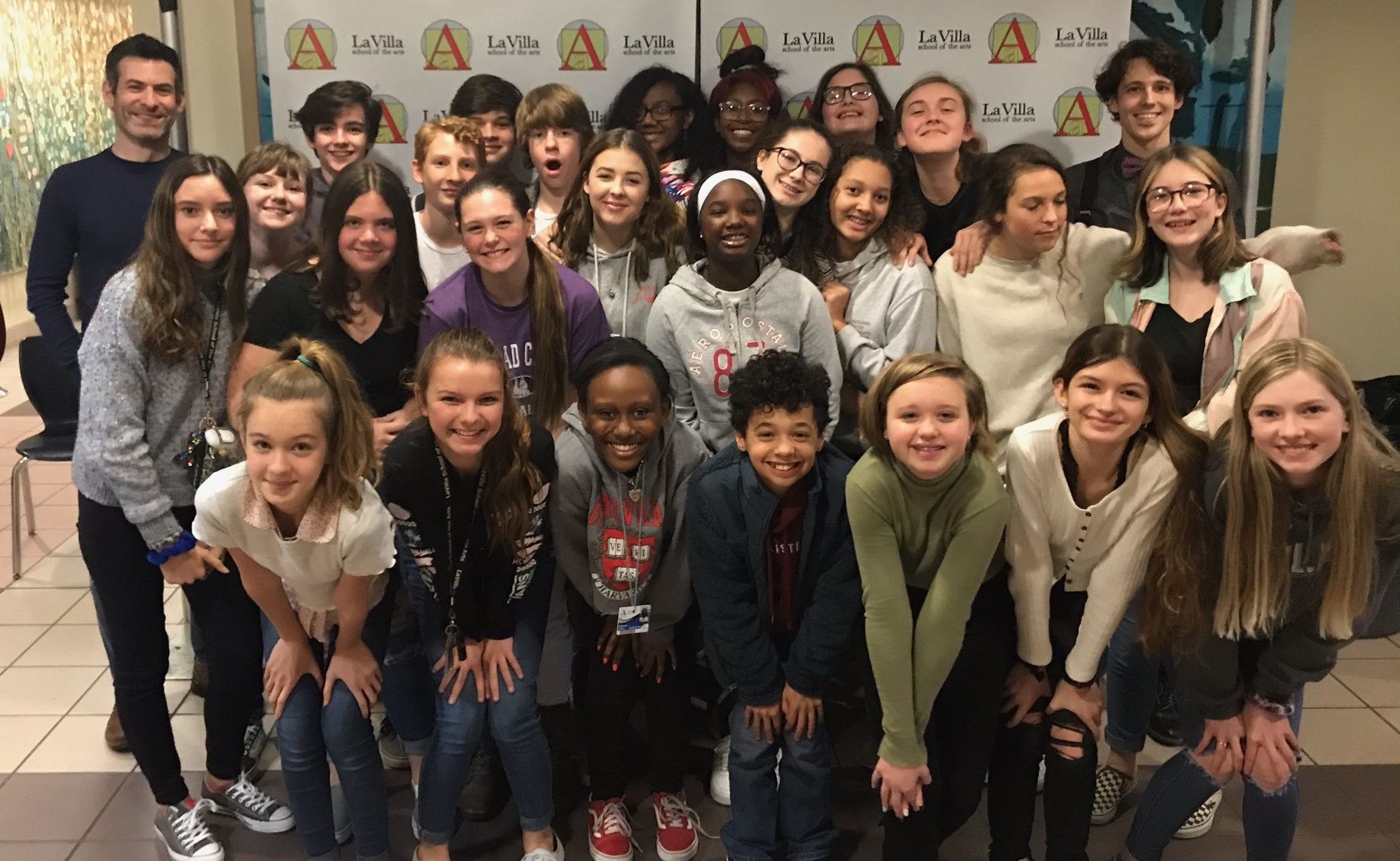 Jonathan posing with students for a group photo