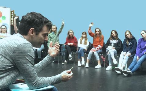 Jonathan speaking with a circle of young actors during an in-person question-and-answer session